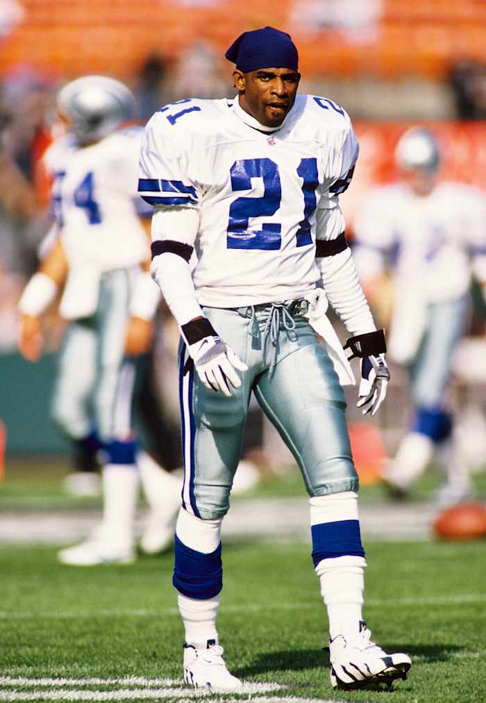 Dallas Cowboys defensive back Deion Sanders warms up before a game in 1996.